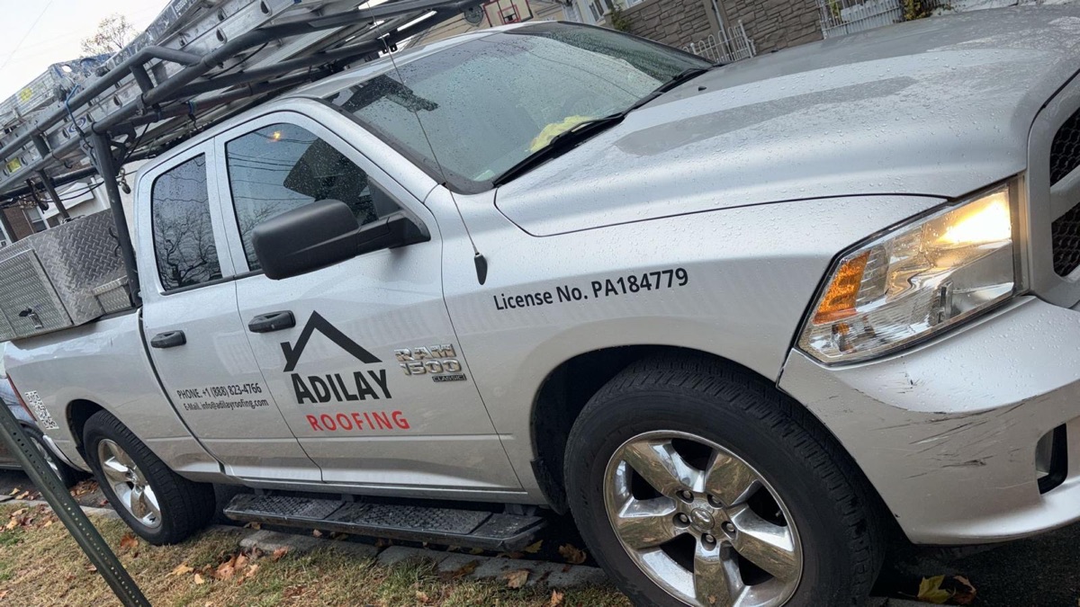 Adilay Roofing branded service truck with company logo and PA license number in Philadelphia